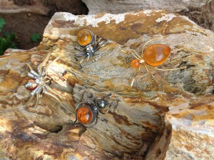 The Amber spiders are Baltic. The Rhinestone spider just worked nicely with the others. On a petrified log in our back yard.